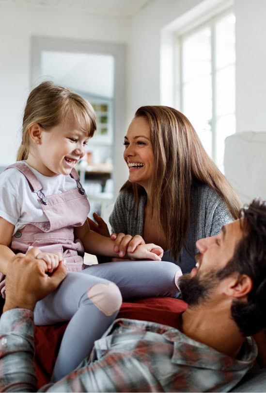 Family relaxing together in their renovated home