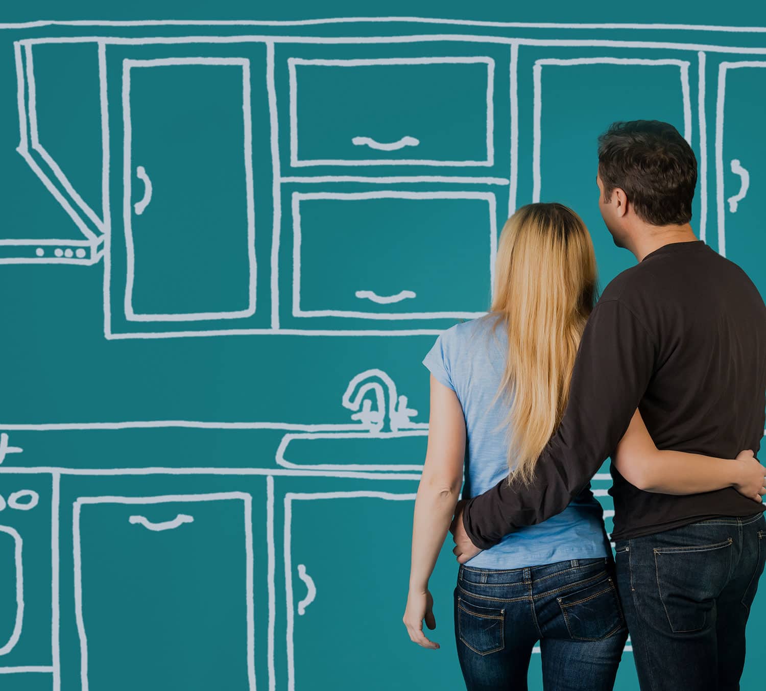 Couple looking at a sketched kitchen design on a teal wall