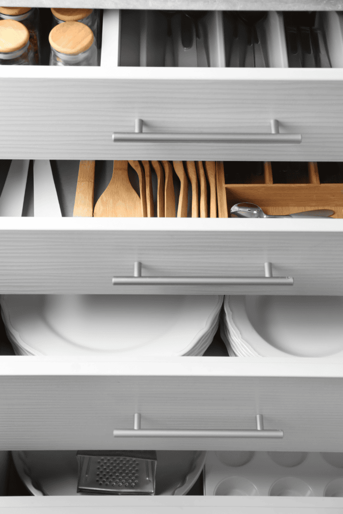 Well-organised kitchen drawers with cutlery dividers and storage